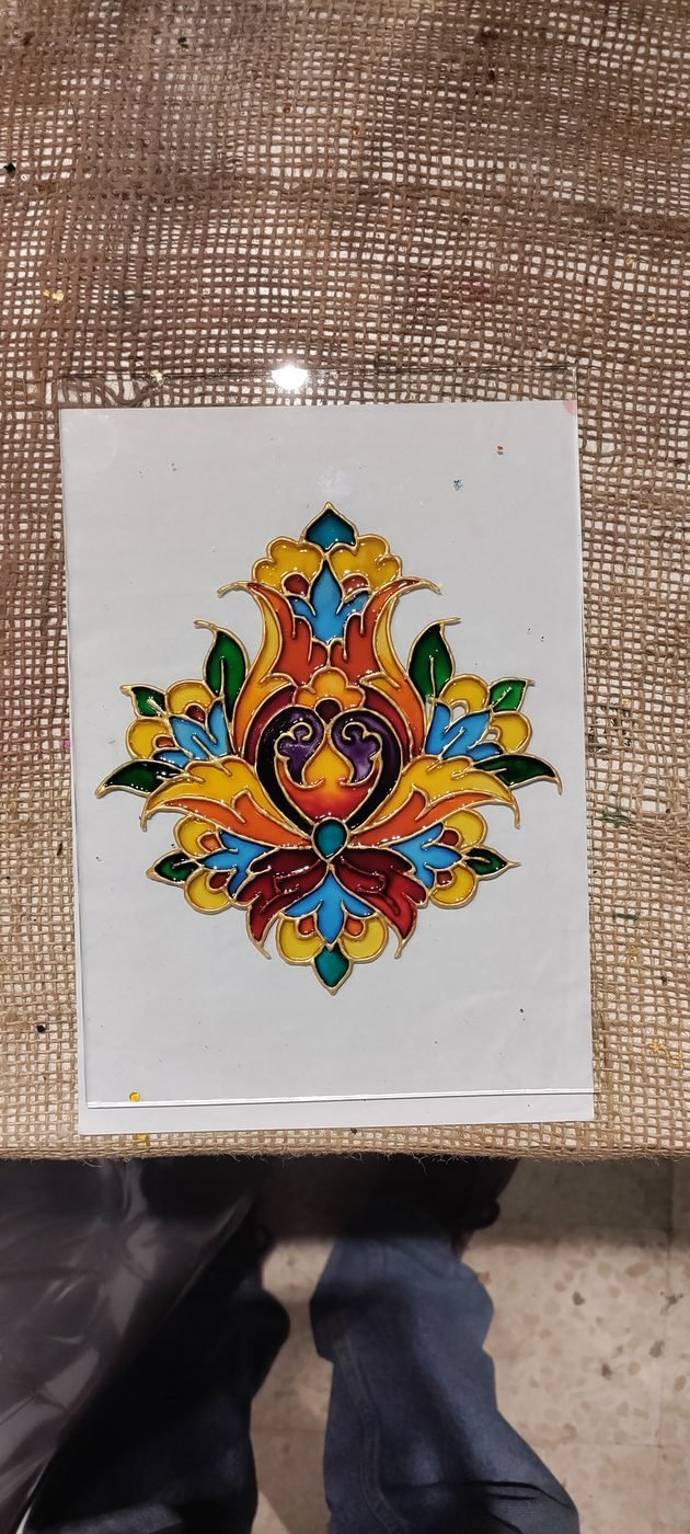 Ornate floral glass painting motif in blue and gold finished at Gilgamesh for Creative Arts, Amman