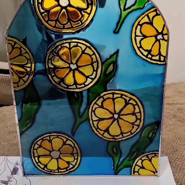 Glass painting of lemons and leaves in a repeating pattern from an Amman glass painting class