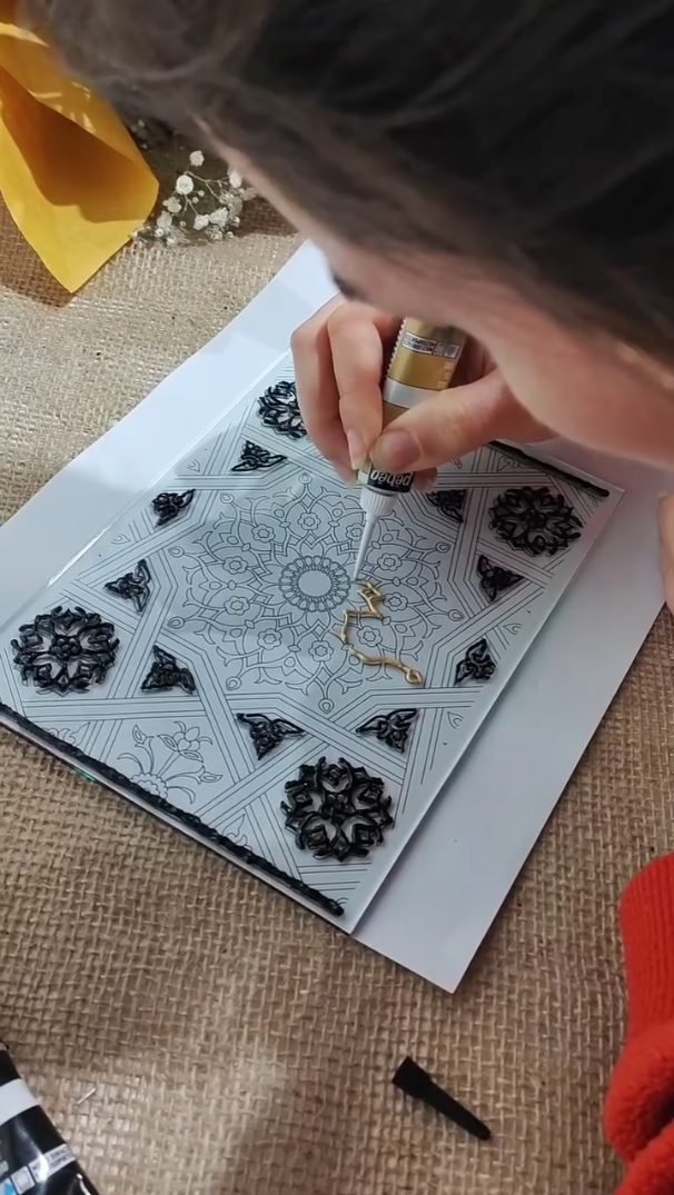 Mandala outlined in creme relief on glass before colour is added, glass painting workshop in Amman