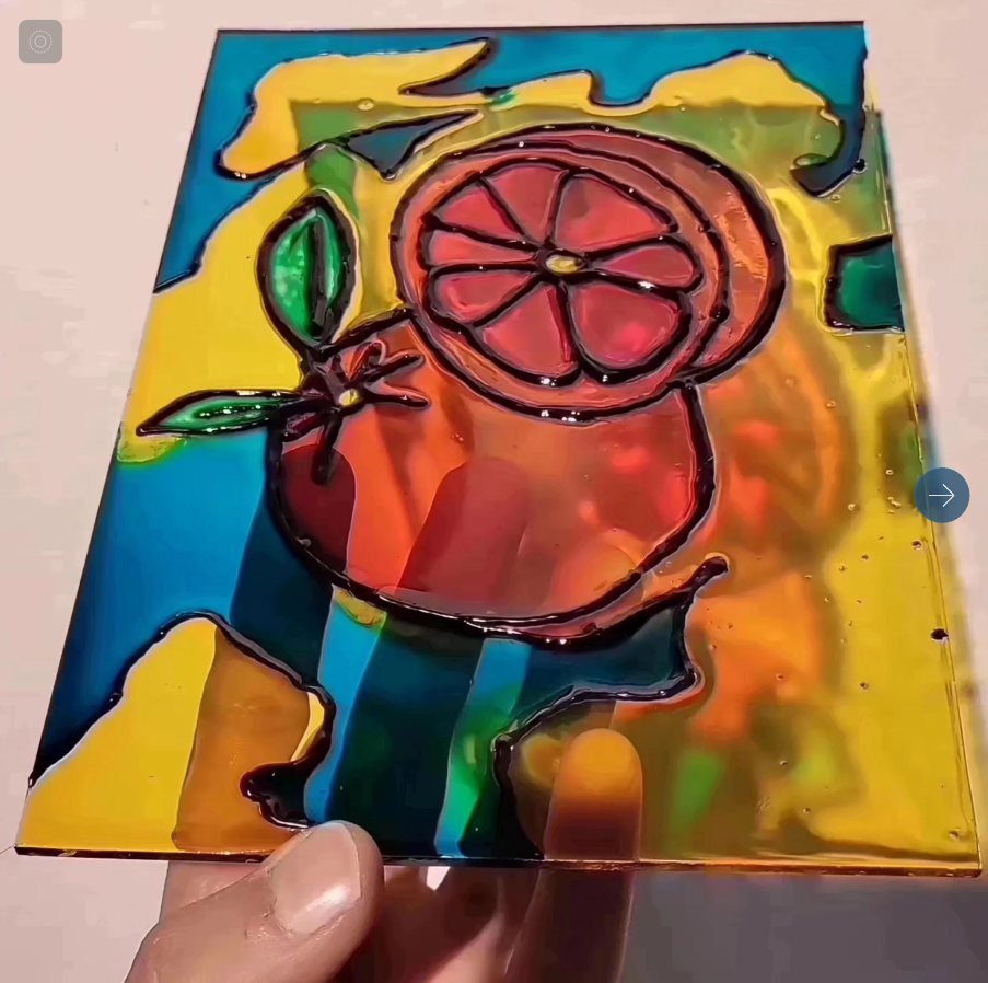 Pomegranate glass painting panel in reds and greens from an Amman glass painting class