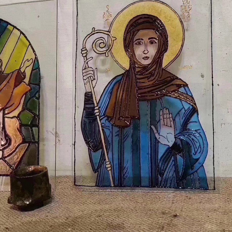 Painted glass icon of a saint with gold detail from the sacred icon workshop in Amman