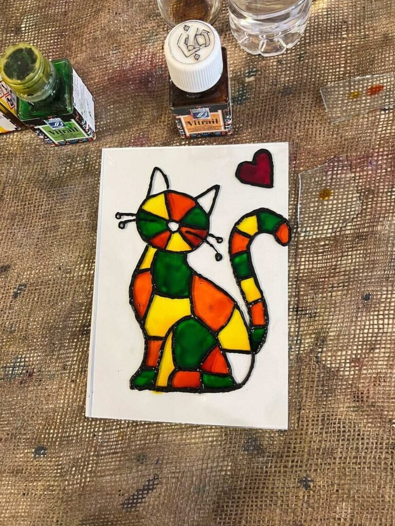 Couples Workshops & Date Night in Amman 2 A cat painted on glass with orange, yellow and green glass paints at Gilgamesh, Amman