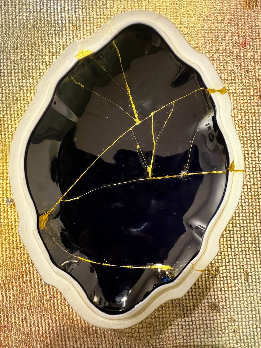 Kintsugi Repair & Restoration in Jordan 5 Blue porcelain dish restored with gold seams, Kintsugi Jordan