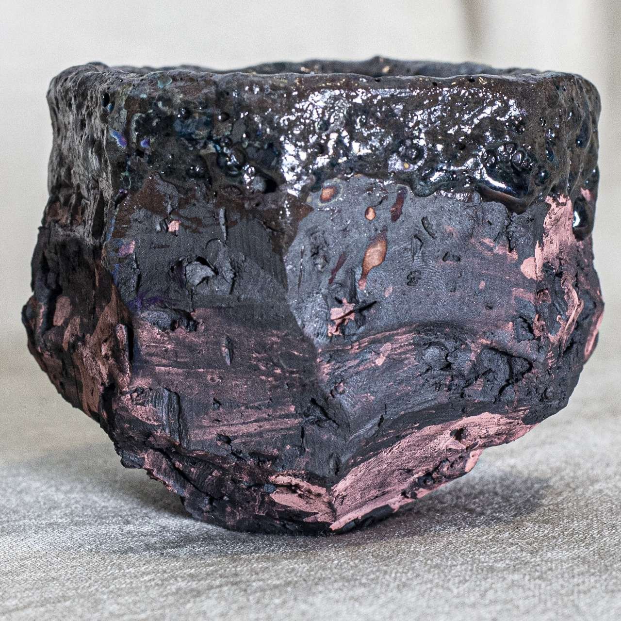 Textured Kurinuki bowl with pink and black glaze, Amman