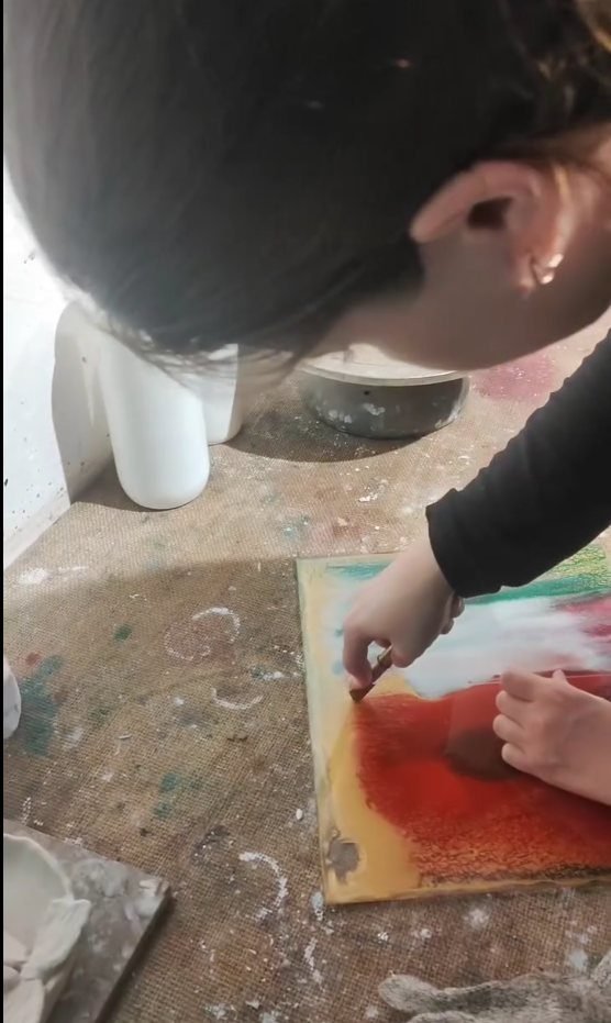 Washing flux off a finished stained glass piece at the studio sink, Gilgamesh for Creative Arts, Amman