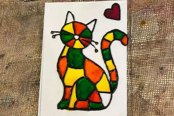 A cat painted on glass at a Gilgamesh glass painting workshop